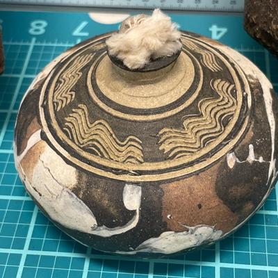 Metal on wood decor with pottery oil candle
