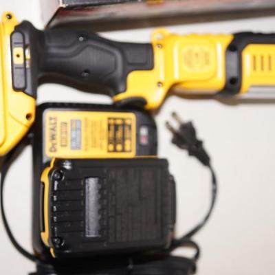 Sale Photo Thumbnail #301: Dewalt handheld work light  or leave on stand to ajust the light 
comes with the 20volt lithium battery. 2021 product 
tested