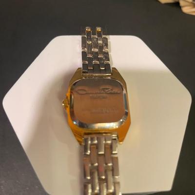 LOT 11: Oscar de la Renta Goldtone Quartz Ladies Wristwatch and Tote Umbrella, Beige Striped Umbrella With Wooden Handle by Neyra, and...