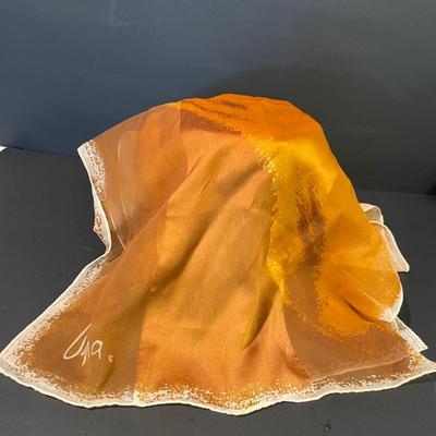 LOT: 12 Shearling Hat and Mittens, Sophia Loren Coffee Table Book, Vintage Brown Leather Powder Compact, and Silk Scarves