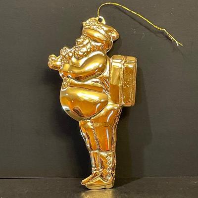 LOT:: 22 . Commemorative Christmas Ornaments, Royal Doulton Santa Head, Silvertone Dinner Bells and Scrooge and Tiny Tim figurine