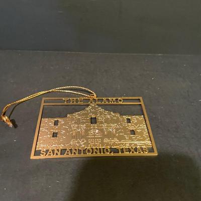 LOT:: 22 . Commemorative Christmas Ornaments, Royal Doulton Santa Head, Silvertone Dinner Bells and Scrooge and Tiny Tim figurine