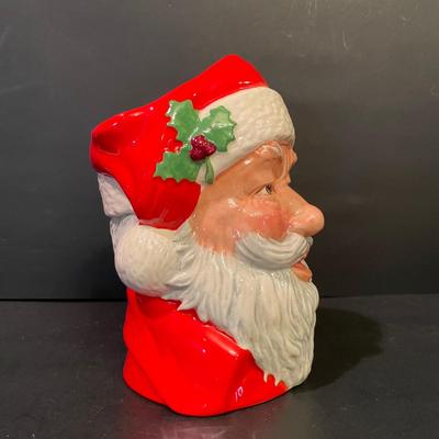 LOT:: 22 . Commemorative Christmas Ornaments, Royal Doulton Santa Head, Silvertone Dinner Bells and Scrooge and Tiny Tim figurine