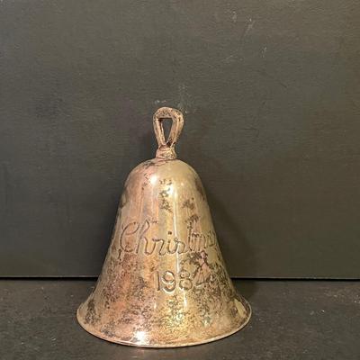 LOT:: 22 . Commemorative Christmas Ornaments, Royal Doulton Santa Head, Silvertone Dinner Bells and Scrooge and Tiny Tim figurine