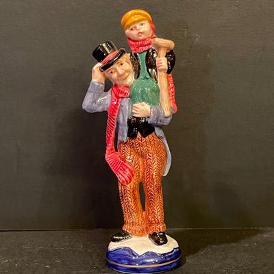 LOT:: 22 . Commemorative Christmas Ornaments, Royal Doulton Santa Head, Silvertone Dinner Bells and Scrooge and Tiny Tim figurine