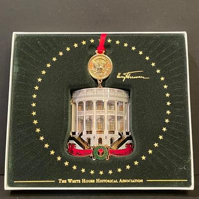 LOT:: 22 . Commemorative Christmas Ornaments, Royal Doulton Santa Head, Silvertone Dinner Bells and Scrooge and Tiny Tim figurine