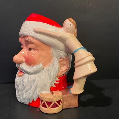 LOT:: 22 . Commemorative Christmas Ornaments, Royal Doulton Santa Head, Silvertone Dinner Bells and Scrooge and Tiny Tim figurine