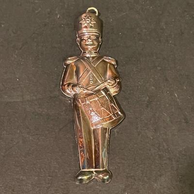 LOT:: 22 . Commemorative Christmas Ornaments, Royal Doulton Santa Head, Silvertone Dinner Bells and Scrooge and Tiny Tim figurine