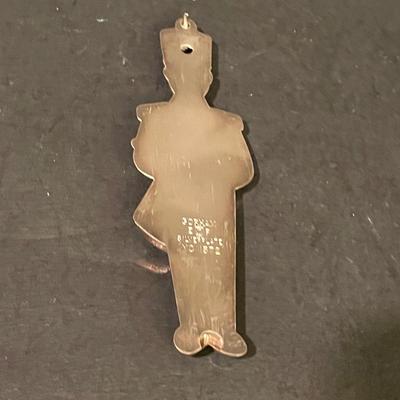 LOT:: 22 . Commemorative Christmas Ornaments, Royal Doulton Santa Head, Silvertone Dinner Bells and Scrooge and Tiny Tim figurine