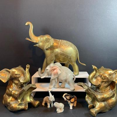 LOT 31: Elephant on Parade Collection of Brass Elephant Book Ends a Brass Elephant from India and Ceramic Figurines