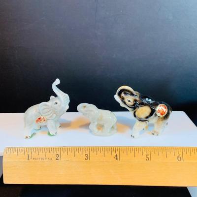 LOT 31: Elephant on Parade Collection of Brass Elephant Book Ends a Brass Elephant from India and Ceramic Figurines