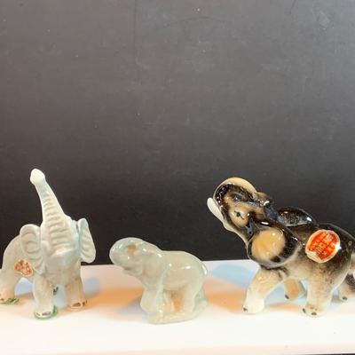 LOT 31: Elephant on Parade Collection of Brass Elephant Book Ends a Brass Elephant from India and Ceramic Figurines
