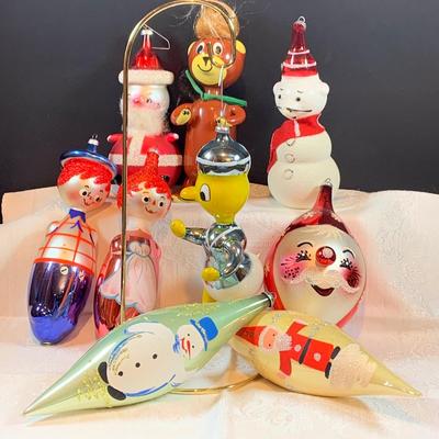 LOT:36: DeCarlini Blown Glass Ornaments Including Duck, Bears, Santas, Raggedy Ann & Andy Snowmen and More