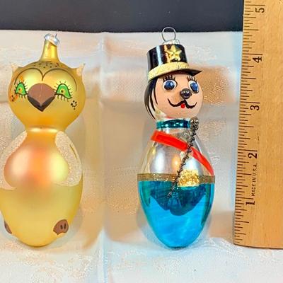 LOT:37: Collection of DeCarlini Blown Glass Ornaments Including Le Befana, Astropup, Mouse, Dutch Girl, soldier, Bird Angel, and Pierrot