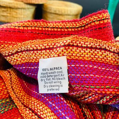 LOT 46: South of the Boarder Collection of Figurines, Baskets with Lids, Blanket and Belt