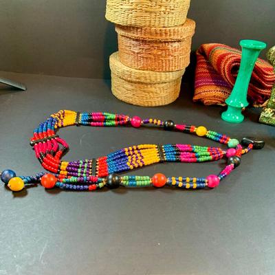 LOT 46: South of the Boarder Collection of Figurines, Baskets with Lids, Blanket and Belt