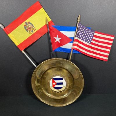 LOT 75: Nautical Books, Flags (Spain, Cuba and USA), Brass Plate and Mini Spittoon, Napolean Figurine and More