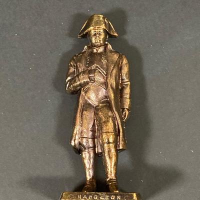 LOT 75: Nautical Books, Flags (Spain, Cuba and USA), Brass Plate and Mini Spittoon, Napolean Figurine and More
