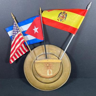 LOT 75: Nautical Books, Flags (Spain, Cuba and USA), Brass Plate and Mini Spittoon, Napolean Figurine and More