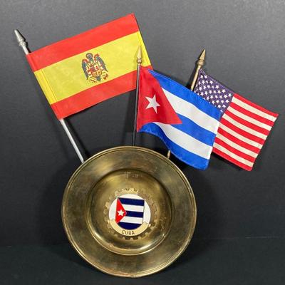 LOT 75: Nautical Books, Flags (Spain, Cuba and USA), Brass Plate and Mini Spittoon, Napolean Figurine and More