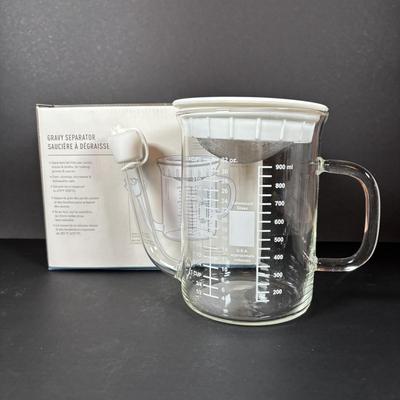 LOT 84: Cuisinart Compact Deep Fryer In Box, (2) Cuisinart 10" Frittata Pans, Glass Gravy Separator in Box, Cutting Board and More