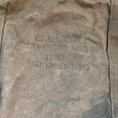 LOT 173: Military Collection - Olive Drab Duffle Bag, Ammo Storage Containers, Cantine Bottle, Saw, Shovel and More