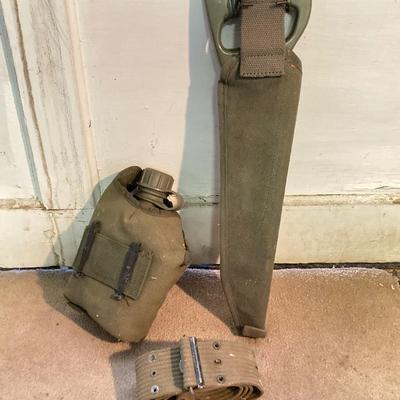 LOT 173: Military Collection - Olive Drab Duffle Bag, Ammo Storage Containers, Cantine Bottle, Saw, Shovel and More