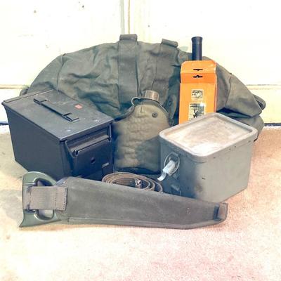 LOT 173: Military Collection - Olive Drab Duffle Bag, Ammo Storage Containers, Cantine Bottle, Saw, Shovel and More