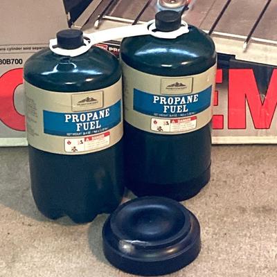 LOT 176: Coleman Collection in Original Packaging - Two Burner Portable Propane Stove, Cast Iron Griddle and Two Tanks