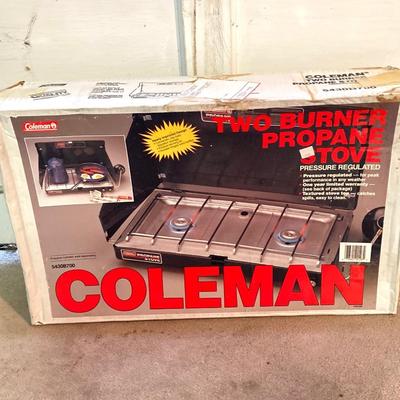 LOT 176: Coleman Collection in Original Packaging - Two Burner Portable Propane Stove, Cast Iron Griddle and Two Tanks