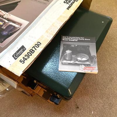 LOT 176: Coleman Collection in Original Packaging - Two Burner Portable Propane Stove, Cast Iron Griddle and Two Tanks