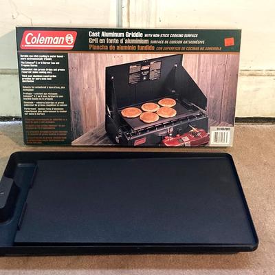 LOT 176: Coleman Collection in Original Packaging - Two Burner Portable Propane Stove, Cast Iron Griddle and Two Tanks