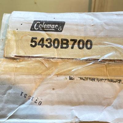 LOT 176: Coleman Collection in Original Packaging - Two Burner Portable Propane Stove, Cast Iron Griddle and Two Tanks