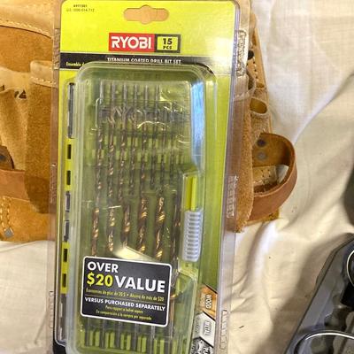LOT 180: Ryobi Cordless Drill, Ryobi Drill Bits, Black & Decker Door Lock Installation Kit and Nicholas Tool Pouch