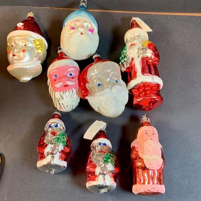 LOT:195: Adorable Christmas Decor Including Precious Moments Rudolph the Red-Nosed Reindeer Santa Figurine, Mikasa Bell, Glass Ornaments,...