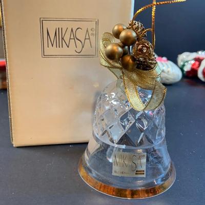 LOT:195: Adorable Christmas Decor Including Precious Moments Rudolph the Red-Nosed Reindeer Santa Figurine, Mikasa Bell, Glass Ornaments,...