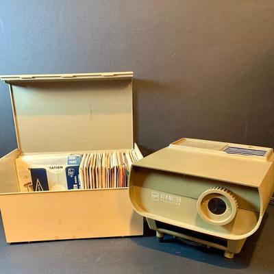 LOT 203: View-Master Projector with a Box of View-Box of Master Stereo Picture Sets - Snow White, Wizard of Oz, Woody Woodpecker,...