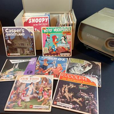 LOT 203: View-Master Projector with a Box of View-Box of Master Stereo Picture Sets - Snow White, Wizard of Oz, Woody Woodpecker,...