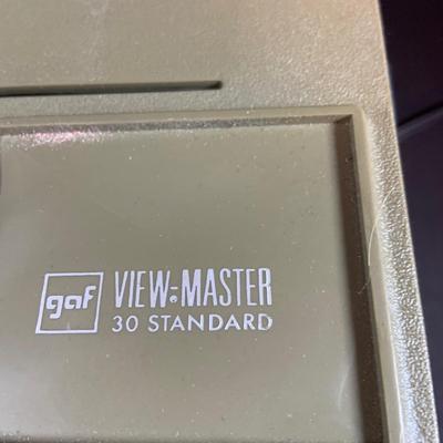 LOT 203: View-Master Projector with a Box of View-Box of Master Stereo Picture Sets - Snow White, Wizard of Oz, Woody Woodpecker,...