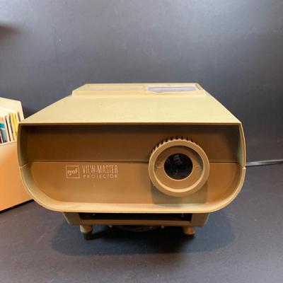 LOT 203: View-Master Projector with a Box of View-Box of Master Stereo Picture Sets - Snow White, Wizard of Oz, Woody Woodpecker,...