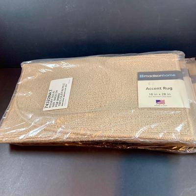 LOT 206: Large Assortment of Unopened Area Rugs In Various Sizes and Shapes.