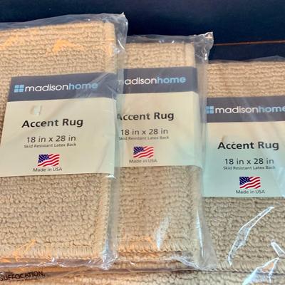 LOT 206: Large Assortment of Unopened Area Rugs In Various Sizes and Shapes.