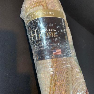 LOT 206: Large Assortment of Unopened Area Rugs In Various Sizes and Shapes.