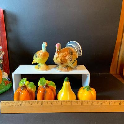 LOT 208: Autumn Decor Featuring Ceramic Pilgrim Head and Hands, Lefton Witch on Pumpkin Lighted Figure, Peanuts Halloween Figures, Salt...