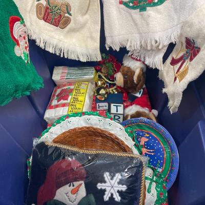 Blue tote with Christmas plates, table cloths and decor