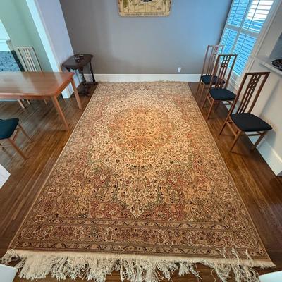 Sale Photo Thumbnail #14: This unbranded area rug is crafted from premium materials using a hand-knotted technique, offering a traditional style with an intricate oriental design. Measuring 8 x 13 feet, it features a medium pile height and is suitable for any room. The rug's elega