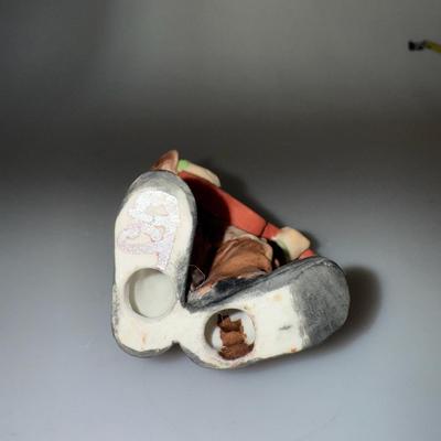 Vintage Emmett Kelly Jr. clown figurine with a guitar
