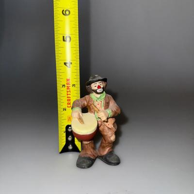 VintageIntroducing the Emmett Kelly Jr. clown figurine featuring a drum.