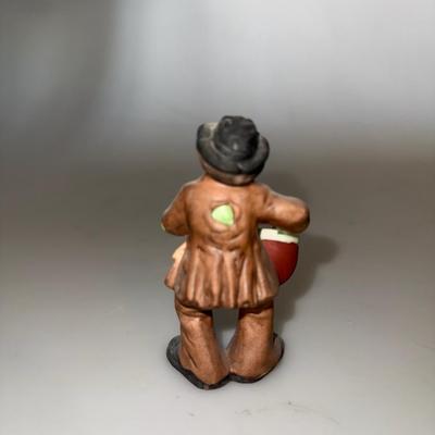 VintageIntroducing the Emmett Kelly Jr. clown figurine featuring a drum.