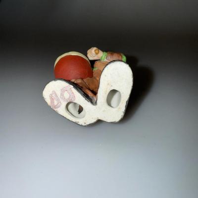 VintageIntroducing the Emmett Kelly Jr. clown figurine featuring a drum.